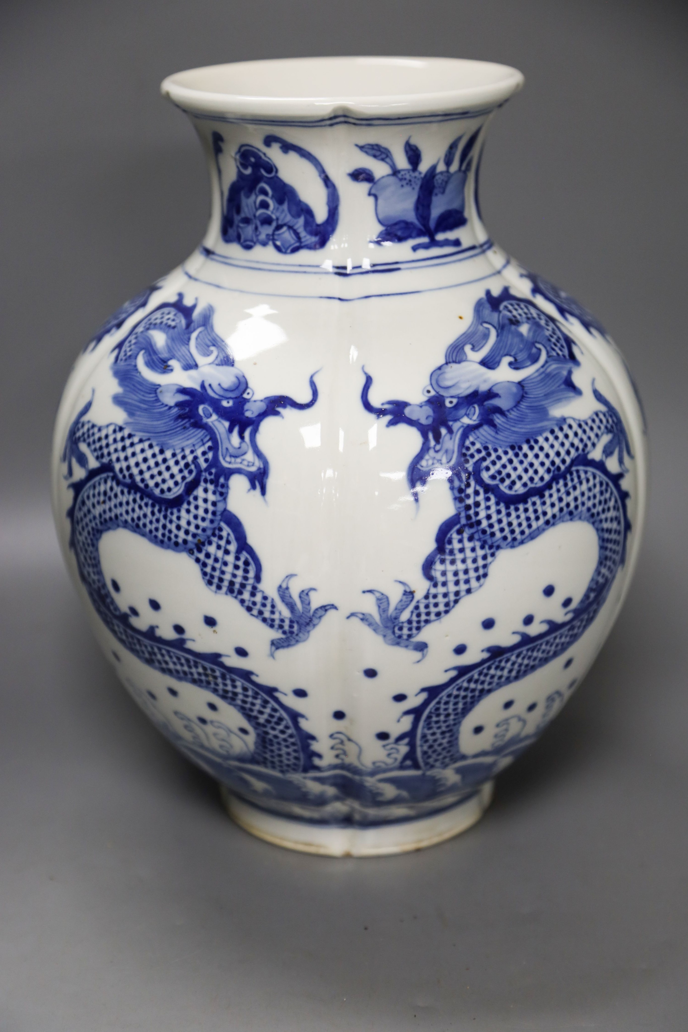 A large Chinese blue and white ‘dragon’ lobed vase, 30cm